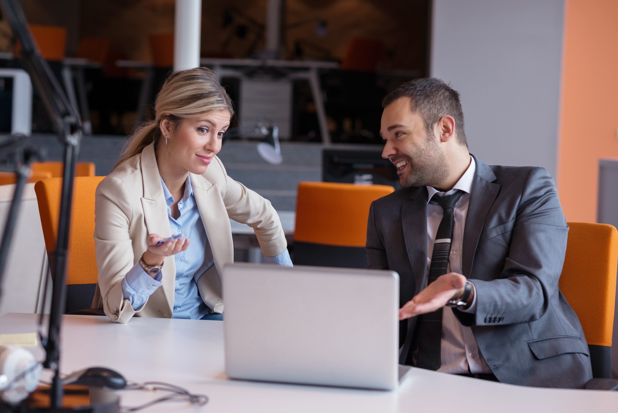 Two businesspeople having an engaging conversation. 