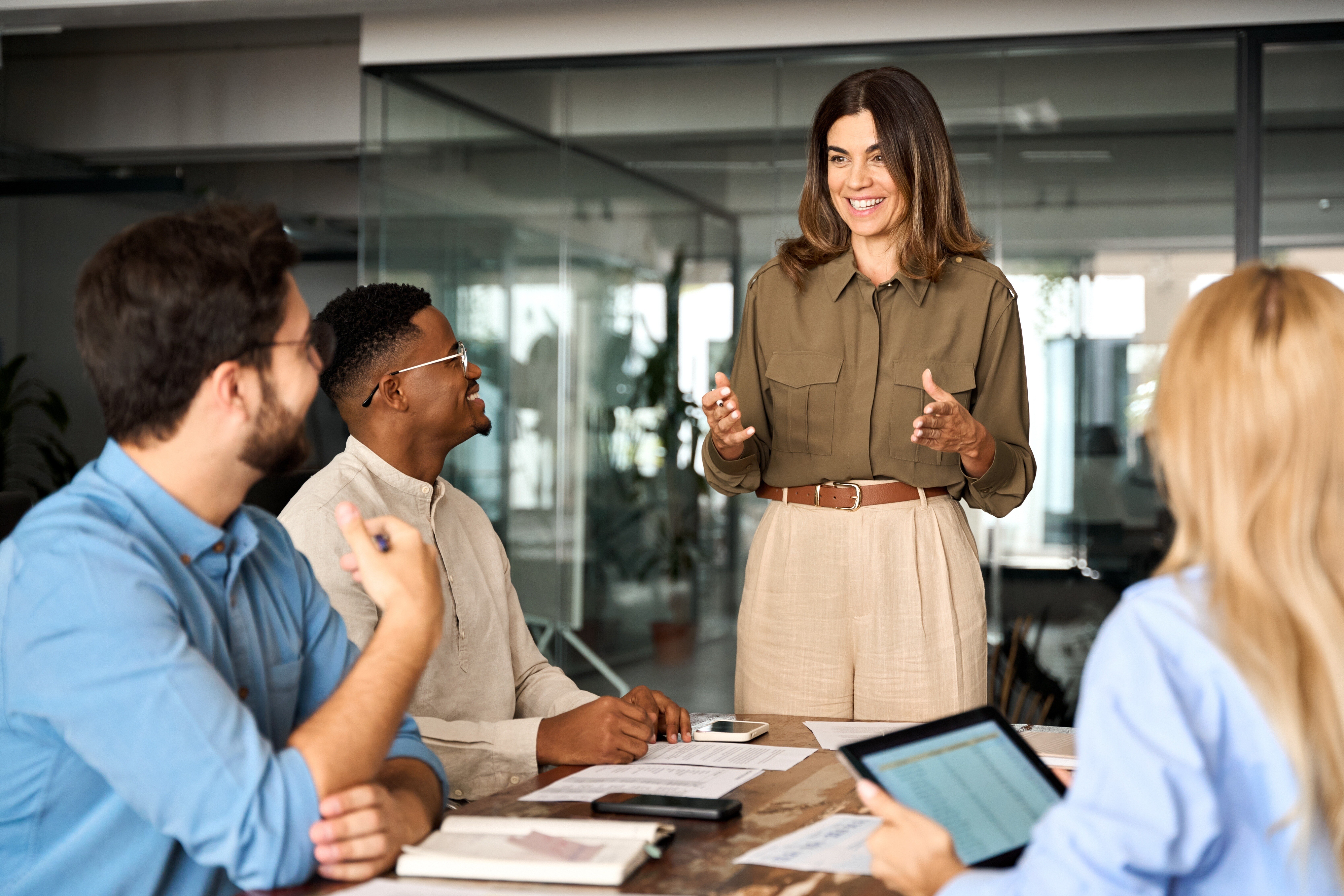 Business person presenting confidently at a meeting 
